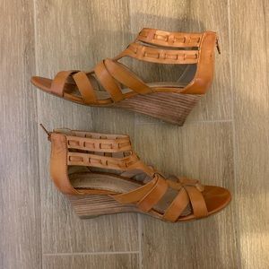 Restricted tan leather wedge sandal
